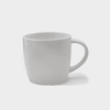 A white ceramic mug with a curved handle and a smooth surface. The mug features a logo.