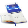 A full-colour blue notebook with an elastic closure, featuring a calendar layout inside and a logo on the cover.