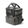 A grey expanding cooler bag with dual compartments, featuring zippers and a sturdy handle for easy transport.