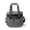 A grey expanding cooler with dual handles, zippers, and a front pocket, featuring adjustable straps and a logo.