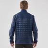 A navy blue men's softshell jacket with a quilted back and raised collar, featuring a logo on the upper left.