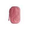 A pink electronic accessory organiser bag with a zip and wrist strap. It includes a small logo.