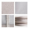 A collection of grey fabric textures, including woven patterns, mesh, and zippers, showcasing material details for a product.