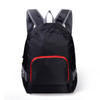 A black backpack with grey straps and a red front pocket, featuring mesh detailing and a logo.