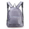 A grey backpack featuring adjustable straps and a front zip pocket, made from lightweight material.