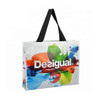 A laminated non-woven trade show bag featuring a vibrant design with splashes of colour and a black strap.