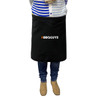 A black waist apron with a logo, worn by a person standing, dressed in casual attire.