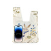 A wrist bag featuring a whimsical rabbit design with a floral background, alongside a smartphone for scale.