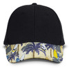 A black cap with a decorated peak featuring palm trees and surfboards in various colours. It has a logo on the front.