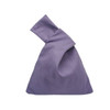 A purple cotton wrist bag with a unique folded design and a single handle. It features a logo on the body.