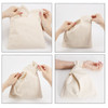 A cream cotton wrist bag is being manipulated, showcasing its flexible design and secure handle.