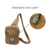 A tan tactical sling bag with a detachable velcro patch and multiple zippered pockets.