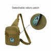A tactical sling bag in olive green, featuring a detachable velcro patch and multiple zippered compartments.