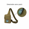 A tactical sling bag in olive green with a detachable velcro patch and adjustable strap. Features multiple zippered pockets.