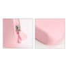 A pink silicone organiser pouch featuring a zip closure and rounded edges. It has a small logo on the side.