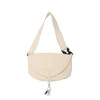 A cream-coloured casual crossbody bag with a flap closure and an adjustable strap, featuring a logo.