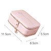 A pink PU leather jewellery case with a mirror, featuring dual zippers and a logo on the lid. Dimensions provided.