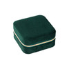 A square, deep green velvet jewellery organiser with a gold zipper. It has a soft texture and compact design.