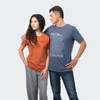 A blue men's T-shirt with a logo, paired with an orange women's T-shirt, both displayed on models.