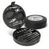 A circular toolkit in a black tyre-shaped case, featuring pliers, screwdriver bits, and various tools.