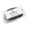 A black silicone wristband packaged in a clear plastic wrapper, featuring a logo.