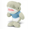 A grey shark plush toy wearing a light blue shirt, featuring a smiling face and soft, fluffy texture.