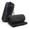 A black fleece blanket rolled and placed next to a matching carry bag, featuring a drawstring closure.