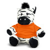 A zebra plush toy with black and white stripes, wearing an orange shirt and featuring a black tuft of fur on its head.