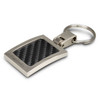 A silver key ring with a carbon-fibre textured panel and a logo. The design is sleek and modern.