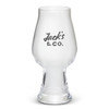 A clear glass beer glass with a wide bowl and a tapered base, featuring a logo.