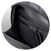 A close-up of the interior of a grey backpack featuring multiple pockets and a zippered compartment.