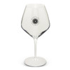 A clear, elegant wine glass with a tall stem, featuring a logo on its side. Suitable for serving various wines.
