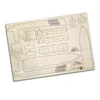 A wooden model kit of a cargo ship, featuring various pre-cut pieces on a light wooden background.