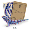 A colourful wooden model of a tuatara, alongside packaging featuring a design and branding elements.