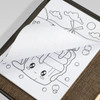 A portable drawing set featuring coloured pencils and a drawing pad with printed outlines for colouring.