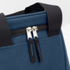 A blue lunch cooler bag featuring dual zipper pulls and sturdy black handles. It has a simple design and a logo.