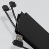 A portable black power bank with integrated charging cables for devices. It features a logo on the surface.