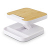 A wireless charging stand with a bamboo top and white base, featuring a sleek, modern design.