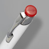 A metal pen with a white barrel and a red button on the top, featuring a shiny silver clip and detailing.