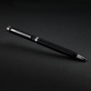 A metal pen in sleek black with silver accents, featuring a branding logo.