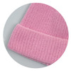 A pink brushed kids beanie with a textured, ribbed cuff and soft fabric. It features a logo on the tag.