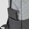 A grey backpack with a black section and a phone stored in a side pocket. It features a logo.