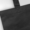 A black tote bag with sturdy handles and a textured fabric surface, featuring a logo.