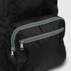 A black foldable backpack with a grey zippered pocket. The material appears lightweight and durable, with a sleek design.