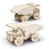 A wooden model of a mining truck, featuring detailed laser-cut designs and a natural wood finish. It has working wheels.