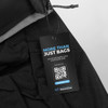 A black backpack with a tag highlighting its eco-friendly features and a logo, displaying the sustainable ethos of the product.