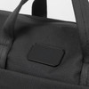A black computer bag with sturdy handles and a branding logo on the front.