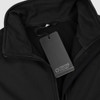 A black softshell jacket with a zip closure and a tag featuring a logo.