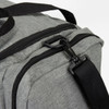 A grey duffle bag featuring a zip closure and a black strap for easy carrying.