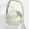 A drink bottle in clear plastic with a light grey lid and handle, featuring a logo on the lid.